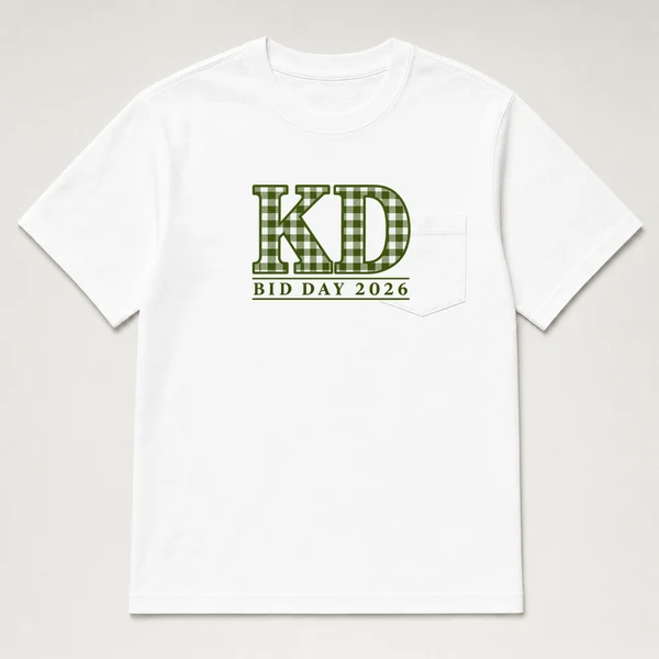 front view of a white pocket tee with stacked KD letters and a bid day 2026 line