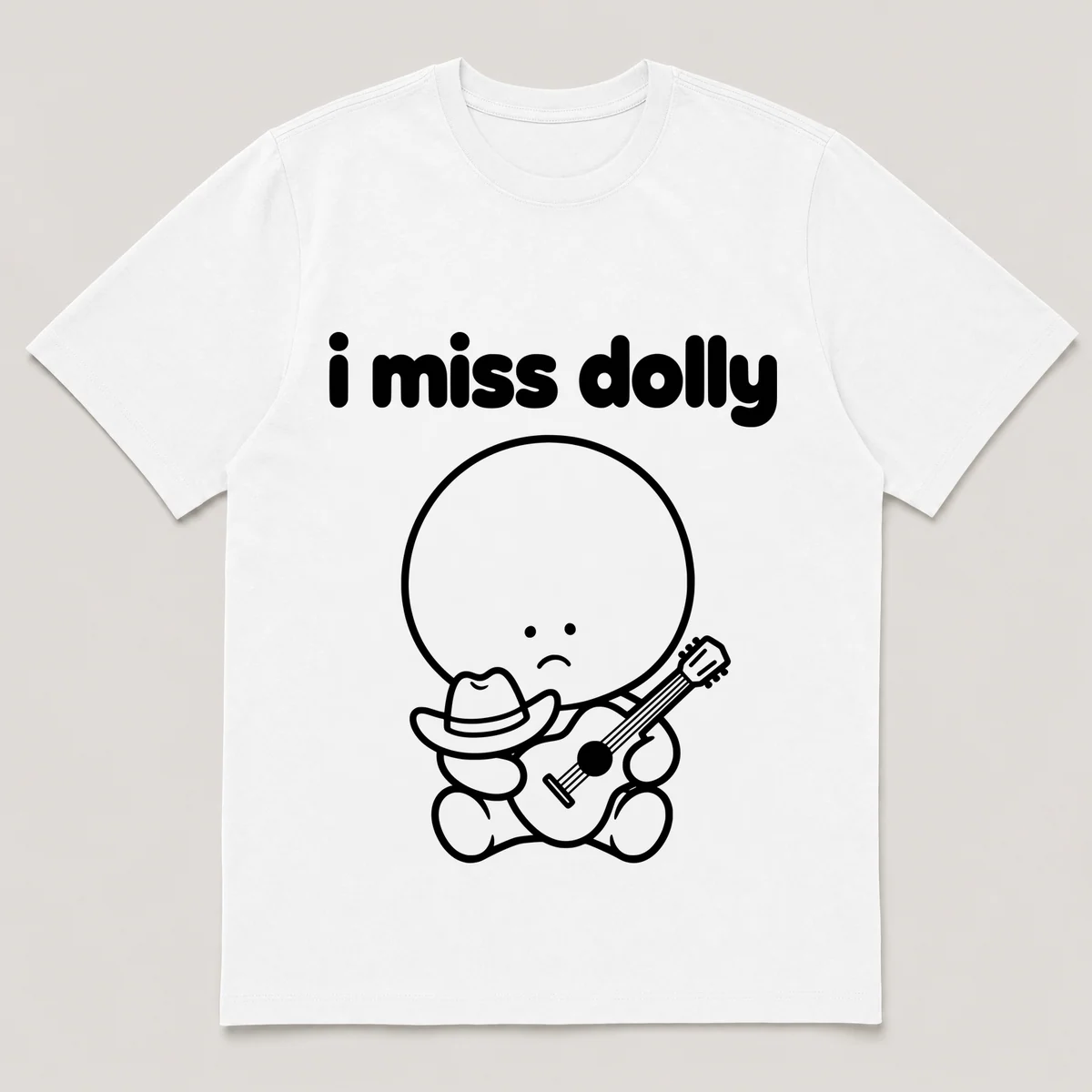 lonely boi tee: a small sad cartoon boy hugging a tiny cowboy hat and a guitar, with the words i miss dolly above him