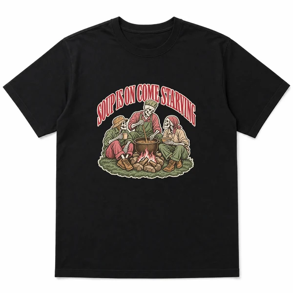 flat lay mockup of a heavyweight tee in black, front view, with the printed design SOUP IS ON COME STARVING across the chest