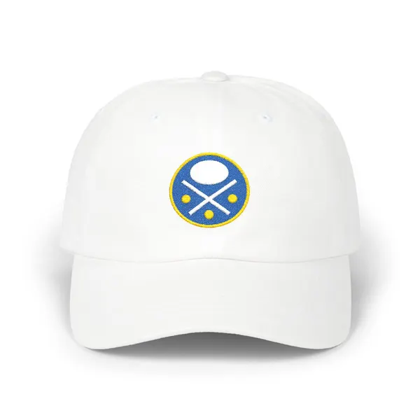 Abstract embroidered shapes in royal blue, white, and gold on a fabric cap.