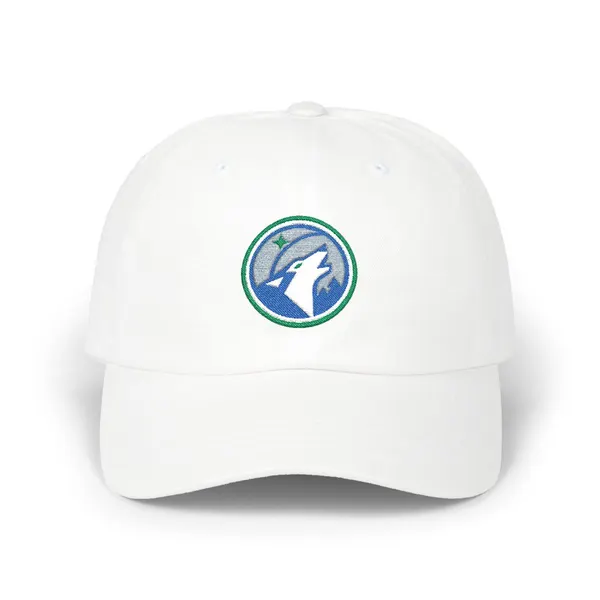 Abstract geometric shapes in royal blue, grey, white, and green embroidery on a cotton cap.