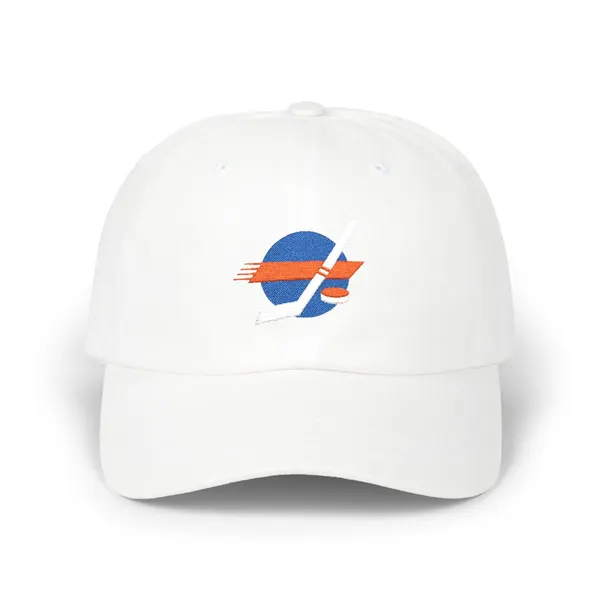 Abstract embroidered shapes in royal blue, orange, and white on a light background.