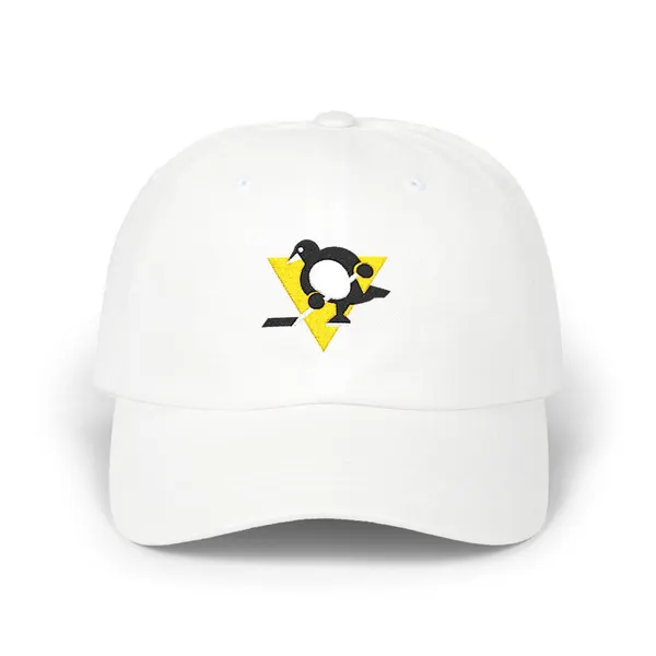 Abstract geometric shapes in off-white, black, and gold embroidery on a fabric cap.