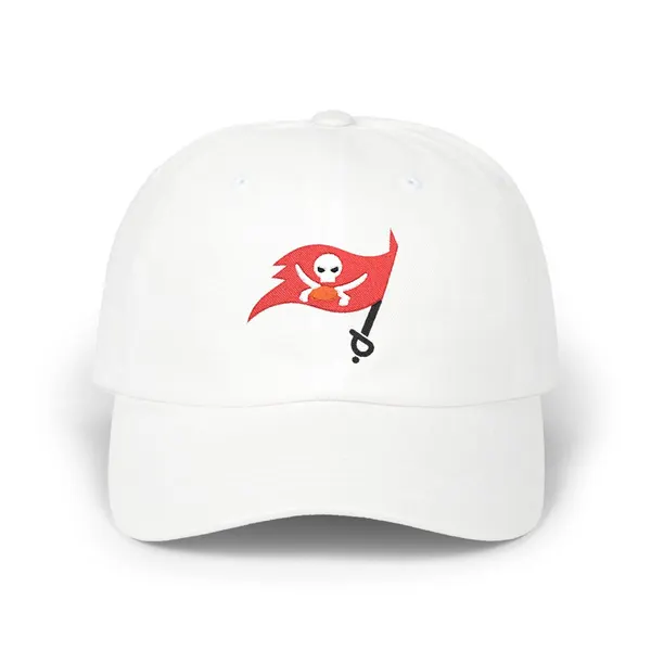 Embroidered abstract shapes in red, off-white, black, and orange on a dark fabric cap.