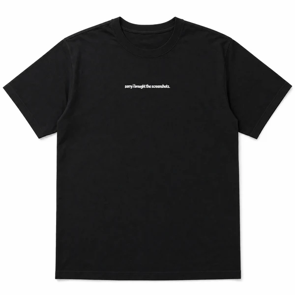 flat lay mockup of a heavyweight tee in black and white, front view, with the printed line sorry i brought the screenshots across the chest