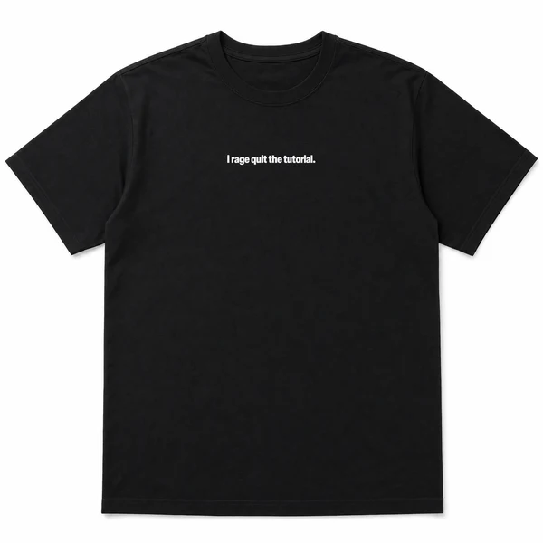 flat lay mockup of a heavyweight tee in black and white, front view, with the printed line i rage quit the tutorial across the chest
