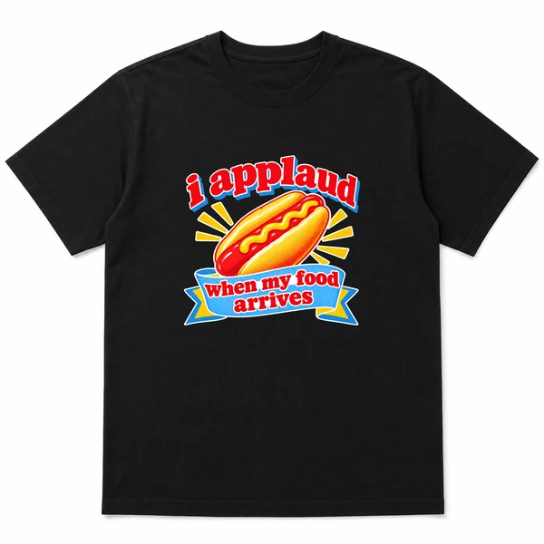 flat lay mockup of a heavyweight tee in black and white, front view, with the printed line i applaud when my food arrives across the chest